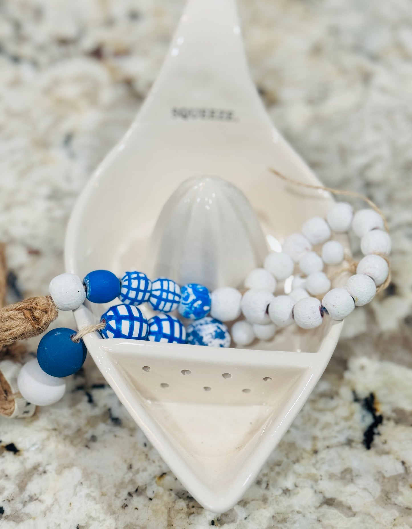 Rae Dunn ceramic SQUEEZE juicer and handmade beaded blue line decor