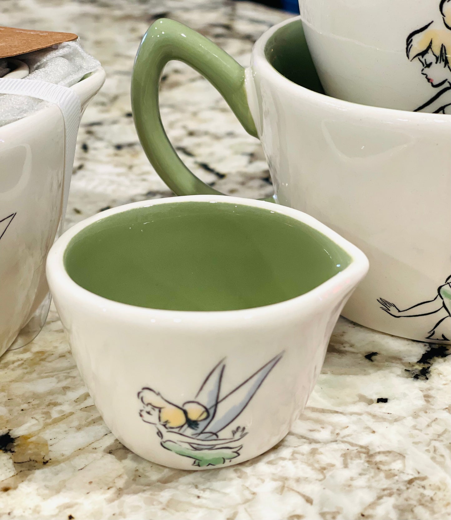 New Rae Dunn x Disney Peter Pan white ceramic, green handles New Release Tinker Bell measuring cup set