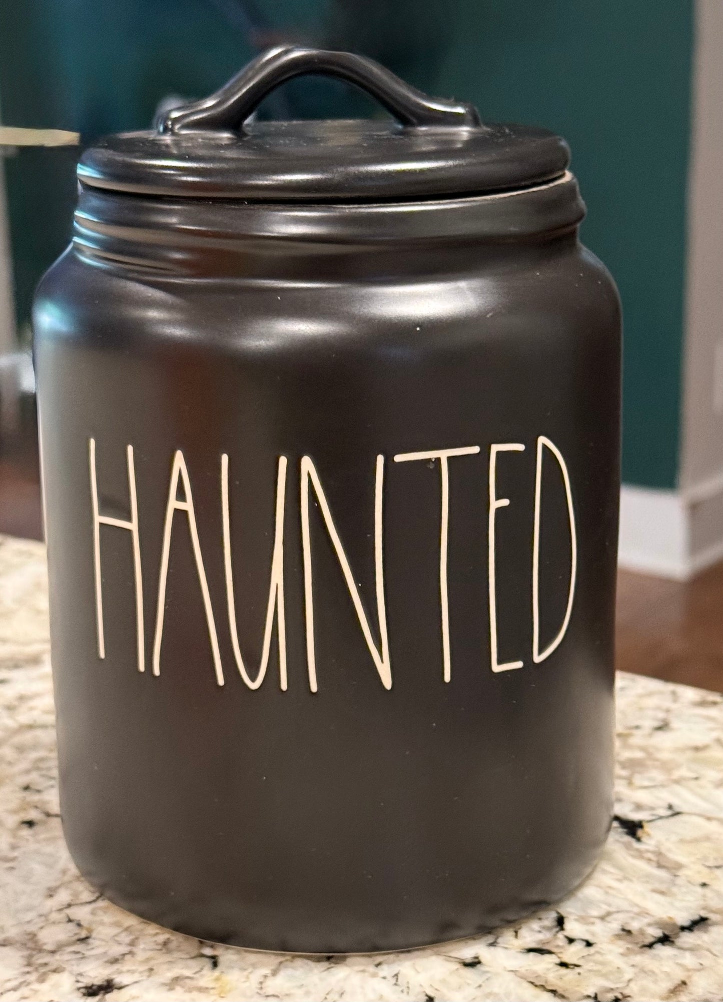 New Rae Dunn black ceramic 8” flat lid Halloween canister HAUNTED white writing