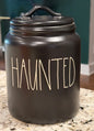 New Rae Dunn black ceramic 8” flat lid Halloween canister HAUNTED white writing