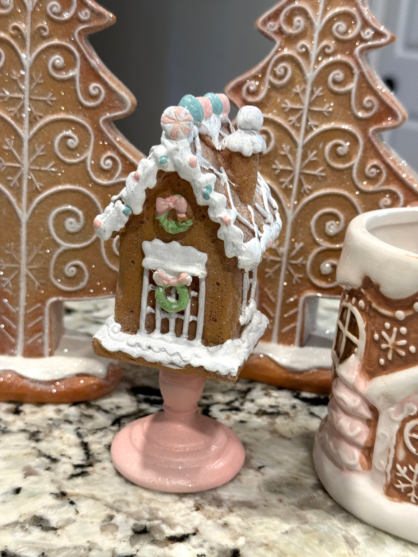 New 4-piece pink gingerbread Christmas lot. 2-8” resin trees, mini house, ceramic mug
