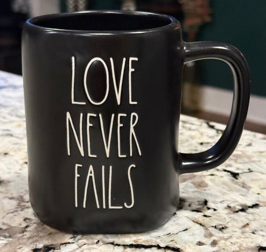 New Rae Dunn black  ceramic coffee mug LOVE NEVER FAILS