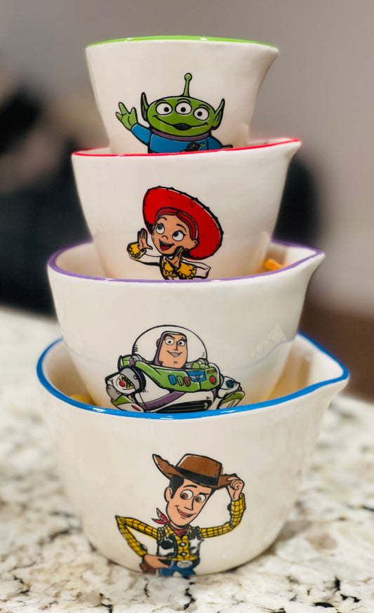 New Release Rae Dunn x Pixar’s Toy Store white ceramic measuring cup set