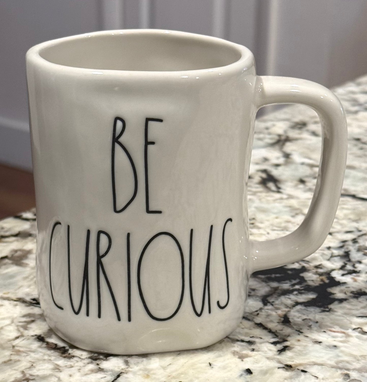Rae Dunn white ceramic coffee mug BE CURIOUS