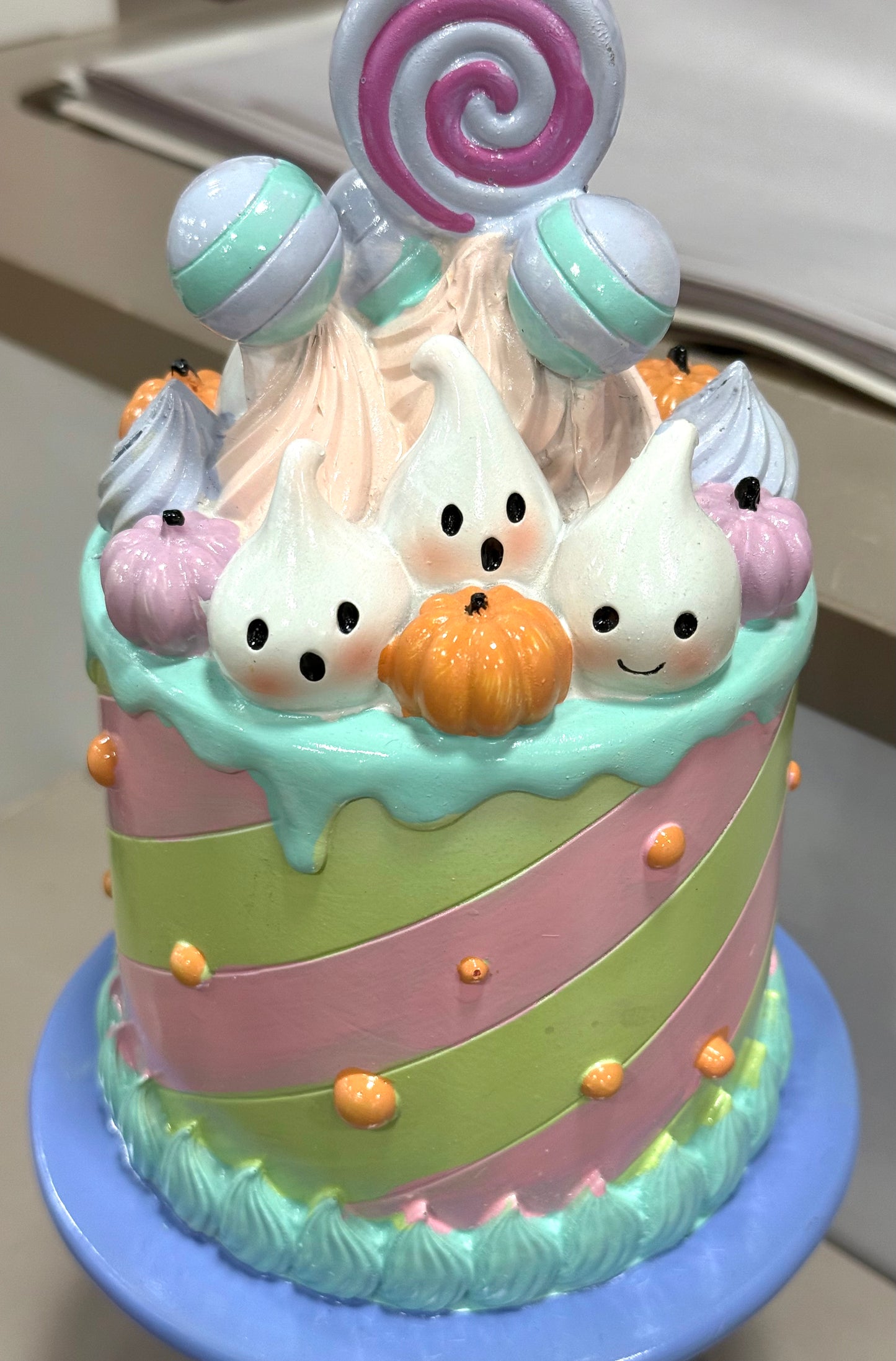 New resin pastel ghost face pink/green striped Halloween pedestal cake decor