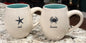Rae Dunn 2-piece ceramic beach theme coffee mug set DISCOVER/WISH